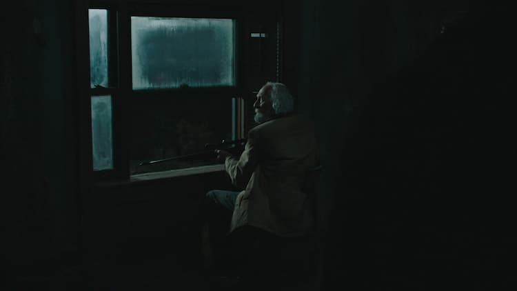 Old man with a sniper rifle