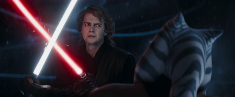 Anakin Skywalker brandishing a red lightsaber and Ahsoka Tano, brandishing a white lightsaber duel. Anakin’s eyes glow yellow and red.