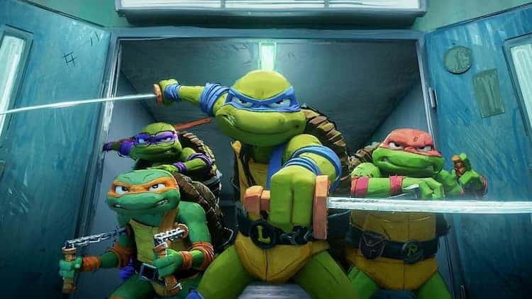 The turtles have their weapons drawn as they are coming through blue doors. They all have a serious look on their faces.