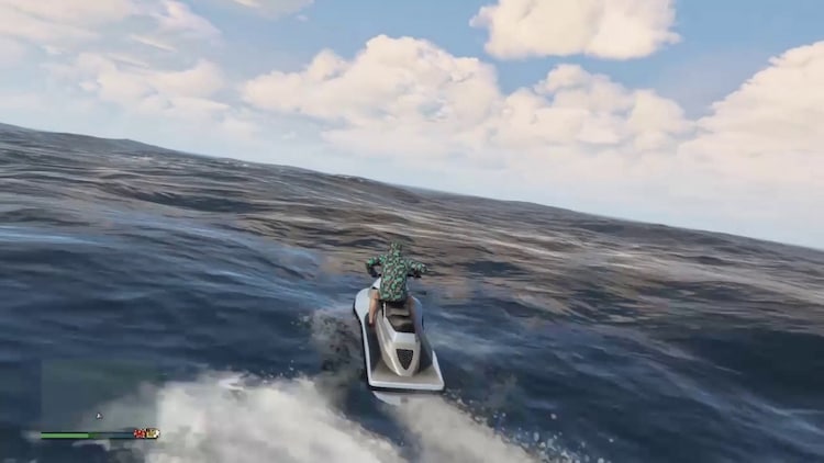 A man on a jet ski in the middle of the ocean