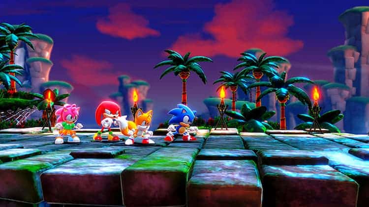 Sonic, Tails, Knuckles, and Amy are in ready positions. Torches are behind them alongside some trees. The sky is dark and ominous.