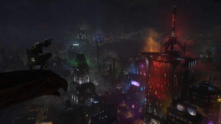 An armored vigilante watches over a brightly and colorfully lit city at night