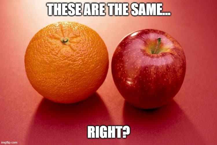 An orange and a red apple laying on a red surface. The words “These are the same… right?” are displayed