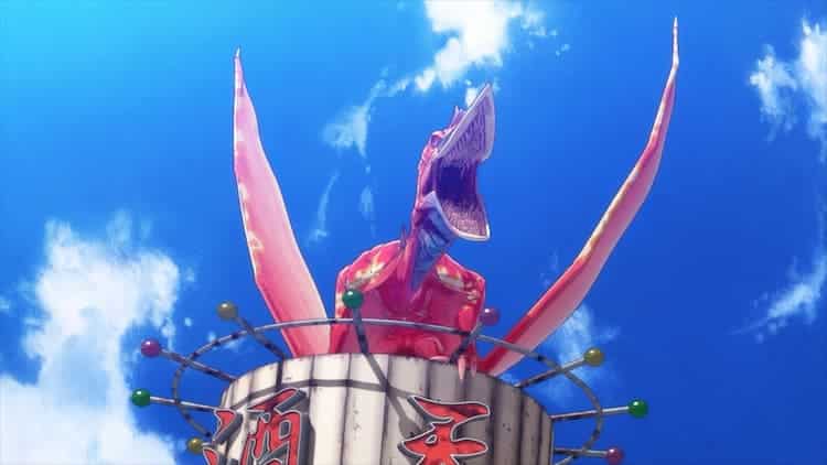 Rodan is on top of a tower. He's roaring and all his teeth are showing. The sky behind is blue wth clouds rolling through.