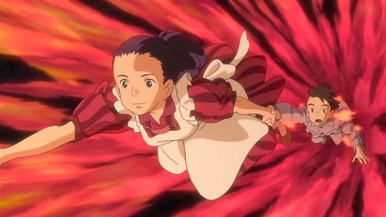 Himi is holding Mahito's hand as they fly through a red corridor of fire. Some flames are on parts of Mahito's body.