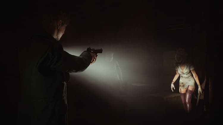 A man is pointing a gun and a flashlight at a monster nurse thing. The monster is walking towards the man in the dark. Another monster is hidden in the shadows.